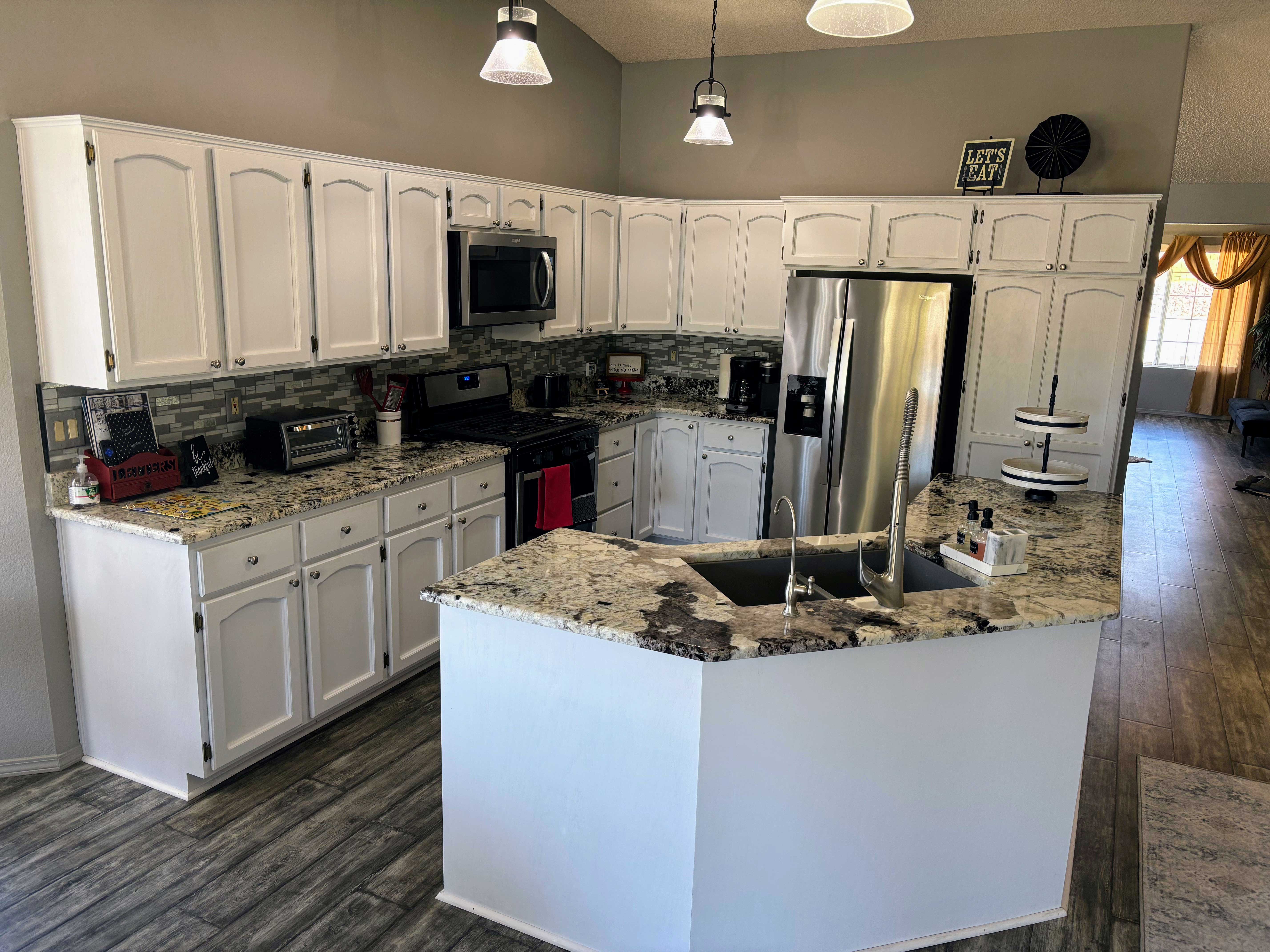 White painted kitchen cabinets by Marcel Painting