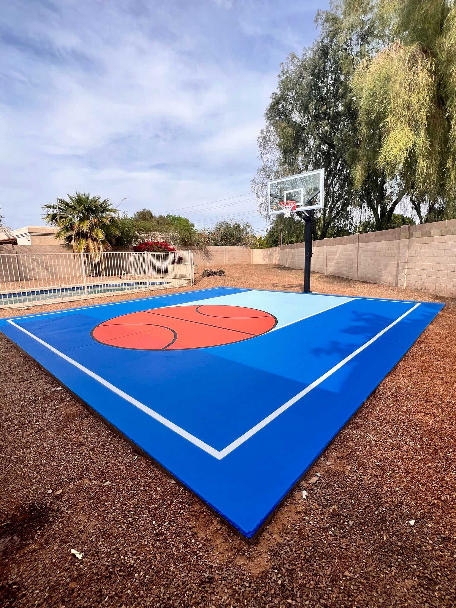 Royal blue half court with basketball center logo